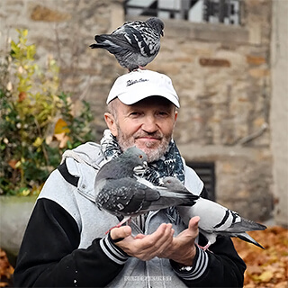 Portrait photographs of the "pigeon man", who lovingly cares for pigeons in the city center of Bochum