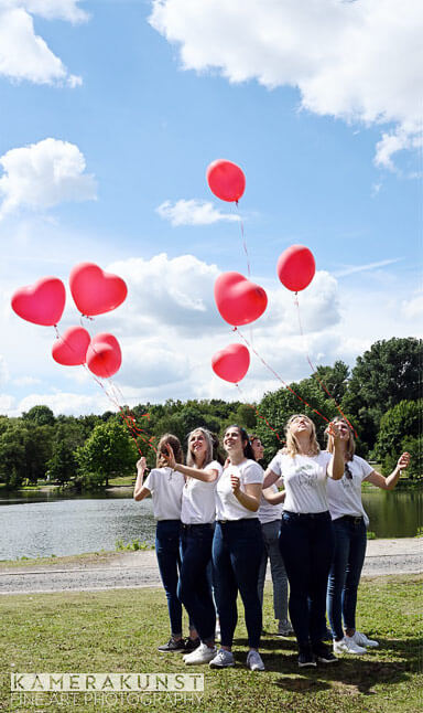 The bride is honored by the bachelorette with heart balloons