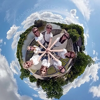 The bride poses with all her friends at a great bachelorette party on a small globe (360° Little Planet), a beautiful and fancy photo memory.
