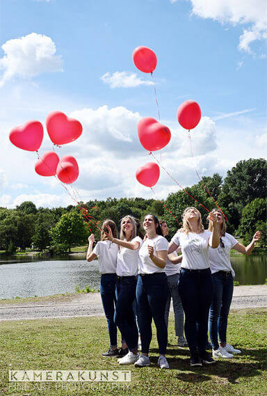 The bachelorettes release heart balloons in honor of the bride